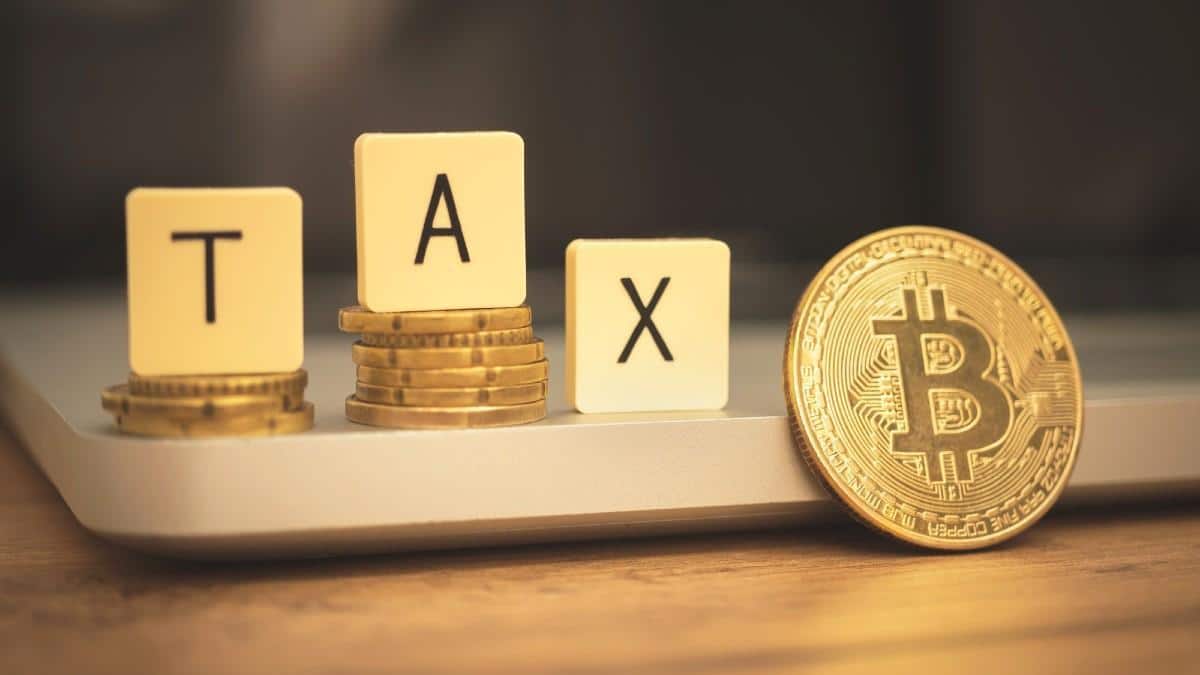 Coins with Tax written on top with a bitcoin