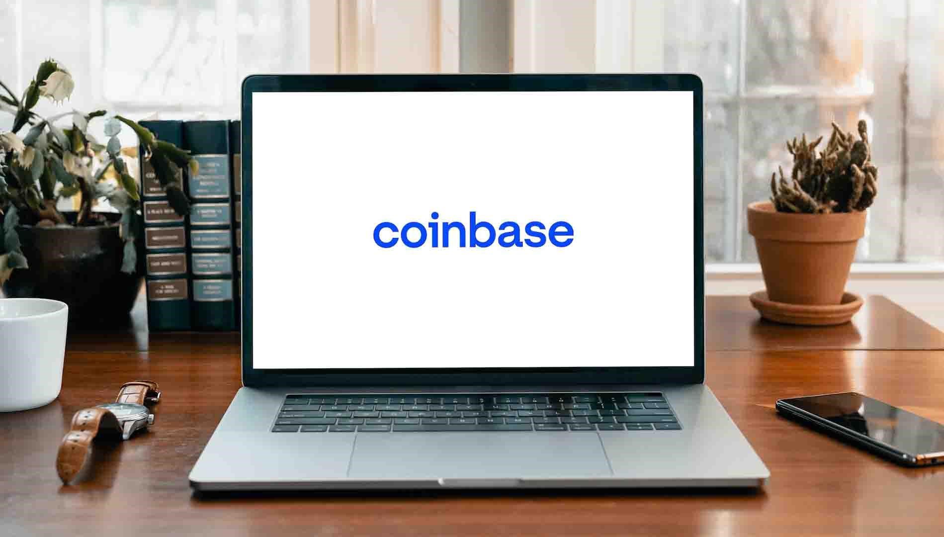 Image of a laptop with the coinbase logo on the screen