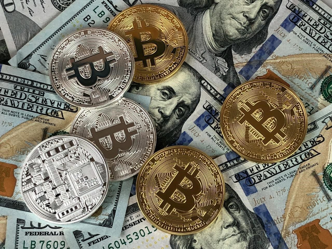 Silver and gold coins with Bitcoin logo
