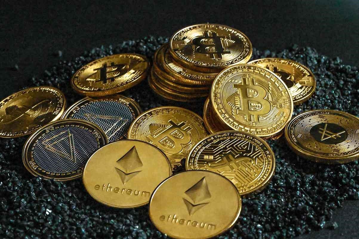 An image of gold coins with logos of Ethereum and Bitcoin
